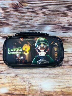 Nintendo Switch Lite Deluxe Travel Case featuring the Luigi's Mansion 3